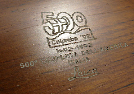 Close up view of the crafted emblem and description found on the Leica M6 Chrome Colombo '92 Special 500th Anniversary Edition collectible rangefinder camera 