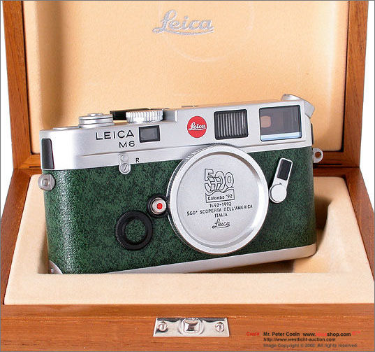 A typical setup of a Leica M6 Chrome Colombo '92 Special 500th Anniversary Edition collectible rangefinder camera with Summicron-M 1:2/50mm Colombo Edition in display wooden box