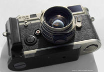 Photo Profile on  Leica Titanium Finish Classic body  with mathing Leica Summilux-M 35mm f/1.4 original version with a black hand grip