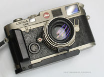Top and nice view of a  Leica Titanium Finish Classic body  with mathing Leica Summilux-M 35mm f/1.4 original version with Black Anodized Hand Grip