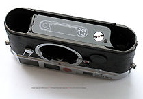 The robust, solid base section of a Leica M6 camera - Shown with Leica Special Rooster edition
