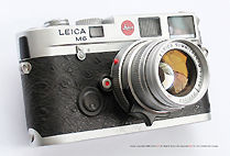 Side view of Leica M6 Classic Year of the Rooster Special / Limited Edition rangefinder camera w/ matching Leica Summicron-M 50mm f/2.0 Rooster edition, 1993