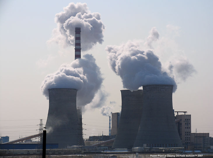 A power Plant with steam rooling out near Daqing Oil Field, China