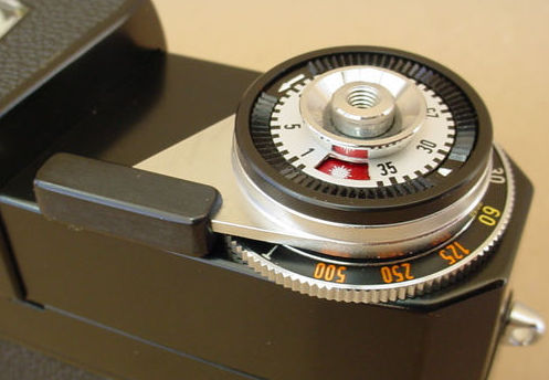 The multi-function section near the shutter release and film advance lever of a Hologon 8/15mm ultraide camera, 1972