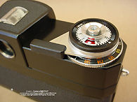 The multi tasks, functions shuter release section with shutter speed selections and film advance lever on a  Zeiss Ikon Hologon ultrawide camera 